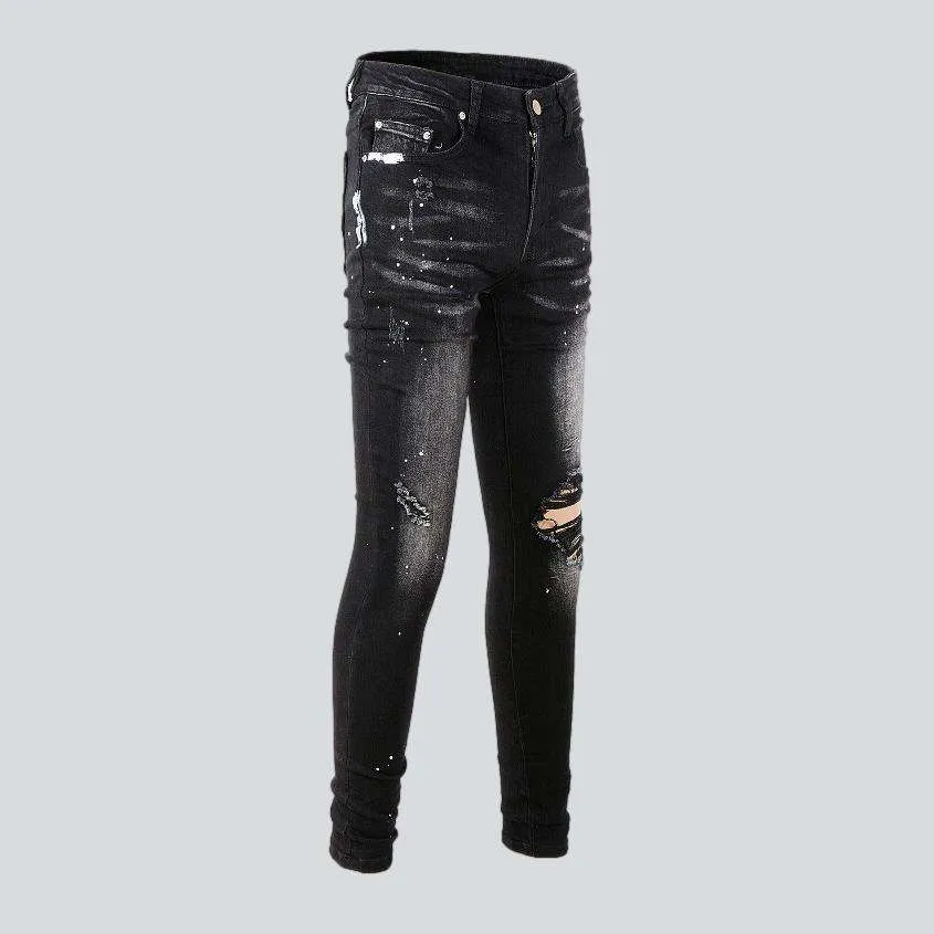 White paint splatters men's jeans